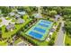 Aerial view showcasing community tennis courts, pond, pool and residences at 1254 Williston Dr, Lawrenceville, GA 30044