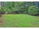 Wide shot of the expansive backyard showcasing a large grassy area at 1254 Williston Dr, Lawrenceville, GA 30044