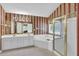 Bathroom with a large mirror, dual sinks, whirlpool tub, and a stand-up shower at 1254 Williston Dr, Lawrenceville, GA 30044
