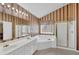 Bright bathroom with a large mirror, dual sinks, whirlpool tub, and a stand-up shower at 1254 Williston Dr, Lawrenceville, GA 30044