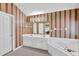 Bathroom with a large mirror, dual sinks, whirlpool tub, and a stand-up shower at 1254 Williston Dr, Lawrenceville, GA 30044