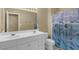 Bright bathroom features double sinks and a dolphin-themed shower curtain at 1254 Williston Dr, Lawrenceville, GA 30044