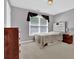 Bedroom with a large window, gray carpet, and a modern headboard at 1254 Williston Dr, Lawrenceville, GA 30044