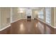 Large living room features hardwood floors, fireplace, and windows with backyard view at 1254 Williston Dr, Lawrenceville, GA 30044