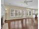 Open-concept living room with hardwood floors, fireplace, and view of the kitchen at 1254 Williston Dr, Lawrenceville, GA 30044