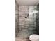 Modern tiled shower boasts elegant fixtures and a convenient recessed shelf at 2443 Abner Nw Pl, Atlanta, GA 30318