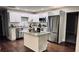 Modern kitchen with white cabinets, stainless steel appliances, granite countertops, and a center island at 2443 Abner Nw Pl, Atlanta, GA 30318