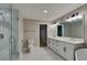 Beautiful bathroom featuring a glass shower, toilet, and and sink with white cabinetry at 247 Millbrook Farm Rd, Marietta, GA 30068
