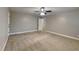 Spacious bedroom with neutral colored walls, carpet flooring, and ceiling fan at 247 Millbrook Farm Rd, Marietta, GA 30068
