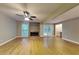 Bright living room with hardwood floors, fireplace, and glass doors to outdoor space at 247 Millbrook Farm Rd, Marietta, GA 30068