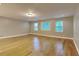 Spacious living room with hardwood floors, neutral walls, and ample natural light at 247 Millbrook Farm Rd, Marietta, GA 30068