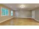 Hardwood flooring and neutral paint in the naturally lit living room at 247 Millbrook Farm Rd, Marietta, GA 30068