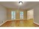Living room featuring hardwood floors, ample natural light, and neutral paint at 247 Millbrook Farm Rd, Marietta, GA 30068