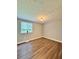 A well-lit bedroom features wood-look floors and a neutral color palette at 3544 Citrus Dr, Duluth, GA 30096