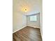 A well-lit bedroom features wood-look floors and a neutral color palette at 3544 Citrus Dr, Duluth, GA 30096
