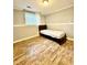Bedroom with new floors, neutral paint, and window with natural light at 3544 Citrus Dr, Duluth, GA 30096