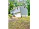 Split-level home with light blue siding, white trim, and a one-car garage at 3544 Citrus Dr, Duluth, GA 30096