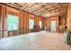 Unfinished basement framed with wood, showing exposed insulation, concrete floors, and windows at 1630 Eaglerock Dr, Suwanee, GA 30024