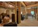 Unfinished basement framed with wood, showing exposed insulation, concrete floors, and wood support columns at 1630 Eaglerock Dr, Suwanee, GA 30024