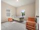 Well-lit bedroom with neutral walls, carpet flooring, and large windows at 1630 Eaglerock Dr, Suwanee, GA 30024