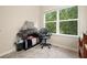 Bright bedroom featuring a gray chair and a window for ample natural light at 1630 Eaglerock Dr, Suwanee, GA 30024