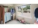 Walk in closet with ample storage and a bright window view at 1630 Eaglerock Dr, Suwanee, GA 30024
