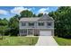 Charming two-story home with brick and siding exterior and well-manicured lawn at 1630 Eaglerock Dr, Suwanee, GA 30024