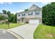Beautiful two-story home showcasing a well-kept lawn and inviting curb appeal at 1630 Eaglerock Dr, Suwanee, GA 30024