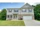 Two-story home with brick accents, neutral siding, shutters, and a well-maintained lawn at 1630 Eaglerock Dr, Suwanee, GA 30024