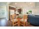 Open-concept kitchen and dining area featuring wood floors, stainless appliances, and modern finishes at 1630 Eaglerock Dr, Suwanee, GA 30024