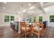 Spacious open concept kitchen with stainless steel sink, table, recessed lighting, and bright windows at 1630 Eaglerock Dr, Suwanee, GA 30024