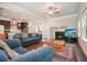 Cozy living room with fireplace, open kitchen, recessed lighting, and bright windows at 1630 Eaglerock Dr, Suwanee, GA 30024