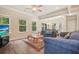 Inviting living room features plenty of natural light, comfortable seating, and wood flooring at 1630 Eaglerock Dr, Suwanee, GA 30024