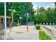 Community splash pad area features colorful water features, lounge chairs, and a pergola for shaded seating at 1630 Eaglerock Dr, Suwanee, GA 30024