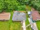 An aerial view of a house with a fenced backyard and a well-manicured lawn at 2049 Phillips Dr, Atlanta, GA 30315