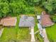 Aerial view of house featuring fenced backyard, new gray roof, and lush green lawn at 2049 Phillips Dr, Atlanta, GA 30315