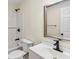 Bathroom with white subway tile, modern fixtures, and a white vanity at 2049 Phillips Dr, Atlanta, GA 30315