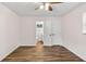 Bedroom with wood-look flooring and a double door closet and bathroom entrance at 2049 Phillips Dr, Atlanta, GA 30315