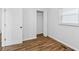 Bedroom featuring wood-look floors, white walls, and a closet at 2049 Phillips Dr, Atlanta, GA 30315