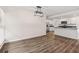 Open dining area with modern light fixture and view of the kitchen at 2049 Phillips Dr, Atlanta, GA 30315
