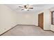 A bedroom offers neutral carpeting, natural light, and closet space at 3328 Hidden Bluff Trl, Snellville, GA 30039