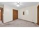 Inviting bedroom with neutral carpeting, ample closet space and a ceiling fan at 3328 Hidden Bluff Trl, Snellville, GA 30039
