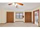 Spacious bedroom with a ceiling fan and closet storage at 3328 Hidden Bluff Trl, Snellville, GA 30039