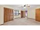 Large bedroom featuring ample closet space, a ceiling fan and neutral carpeting at 3328 Hidden Bluff Trl, Snellville, GA 30039