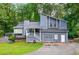 Charming two-story home with an attached garage and a well-maintained front yard at 3328 Hidden Bluff Trl, Snellville, GA 30039