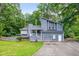 Charming two-story home with an attached garage and a well-maintained front yard at 3328 Hidden Bluff Trl, Snellville, GA 30039