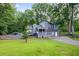 Charming two-story home with an attached garage and a well-maintained front yard at 3328 Hidden Bluff Trl, Snellville, GA 30039