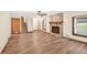 Bright living room with hardwood floors, stone fireplace, and natural light at 3328 Hidden Bluff Trl, Snellville, GA 30039