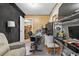 A functional office space with sound dampening features, desk and shelving at 3328 Hidden Bluff Trl, Snellville, GA 30039