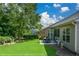 The backyard boasts a patio with outdoor seating and lush green lawn, perfect for relaxation at 505 Appalachian Woods Dr, Canton, GA 30114